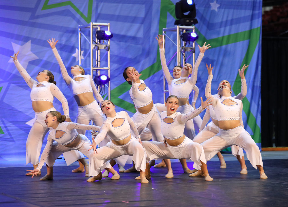 Dance team hitting pose mid performance.