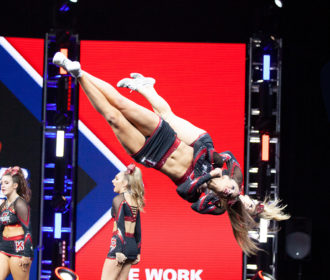 Cheerleaders tumbling action shot at NCA All Star Nationals