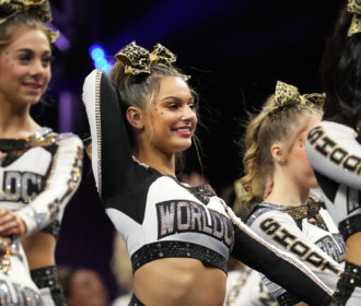 Cheerleaders smiling and posing at NCA All Star Nationals