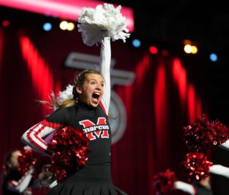 Cheerleader competing at NCA High School Nationals