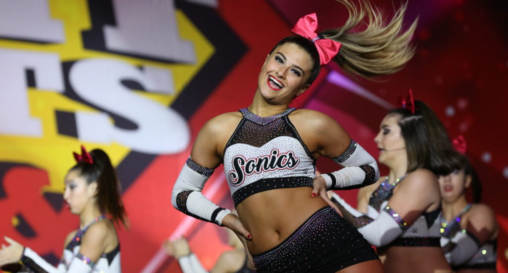 Cheerleader whips her hair to the side in routine